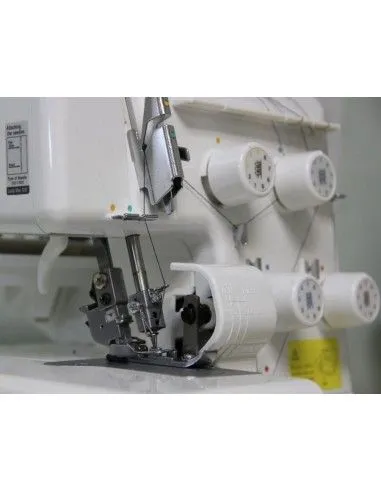 The cutting blade is in a safe position and can be easily removed on the Juki MO654DEN overlock machine